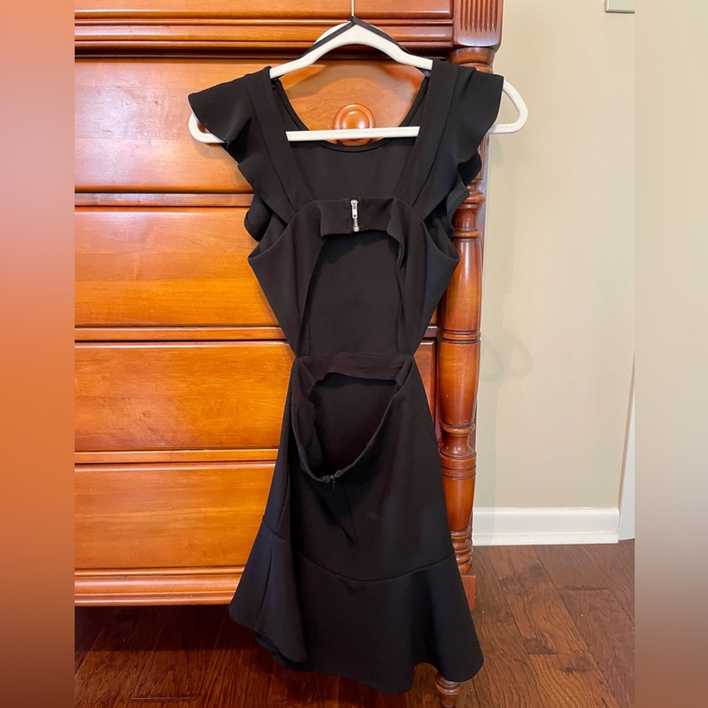 Adorable mini dress with cut outs and ruffle trim on the bottom!! - Picture 2 of 4